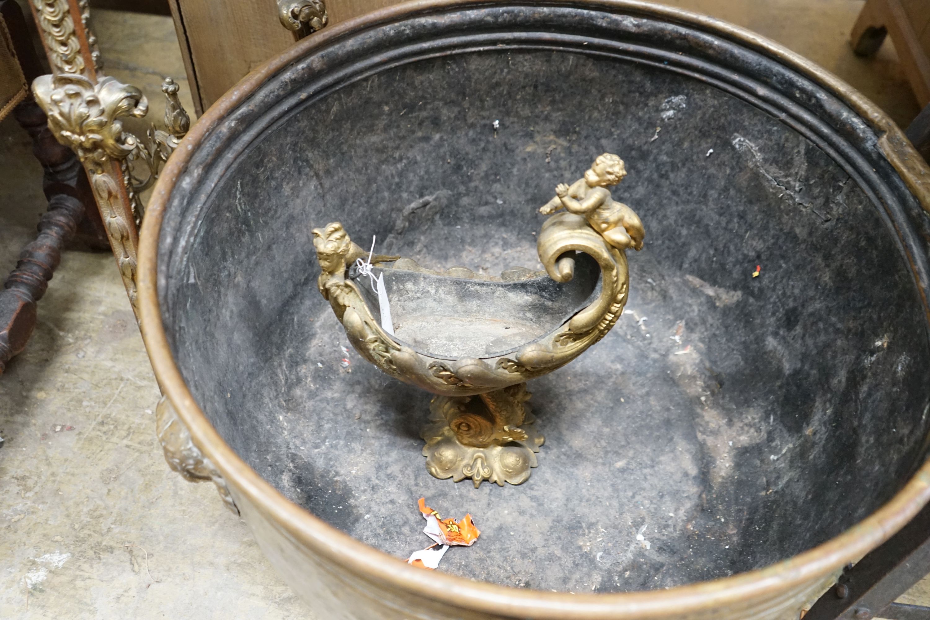 A large Dutch embossed brass circular log bin, diameter 63cm together with a gilt metal cornucopia centrepiece